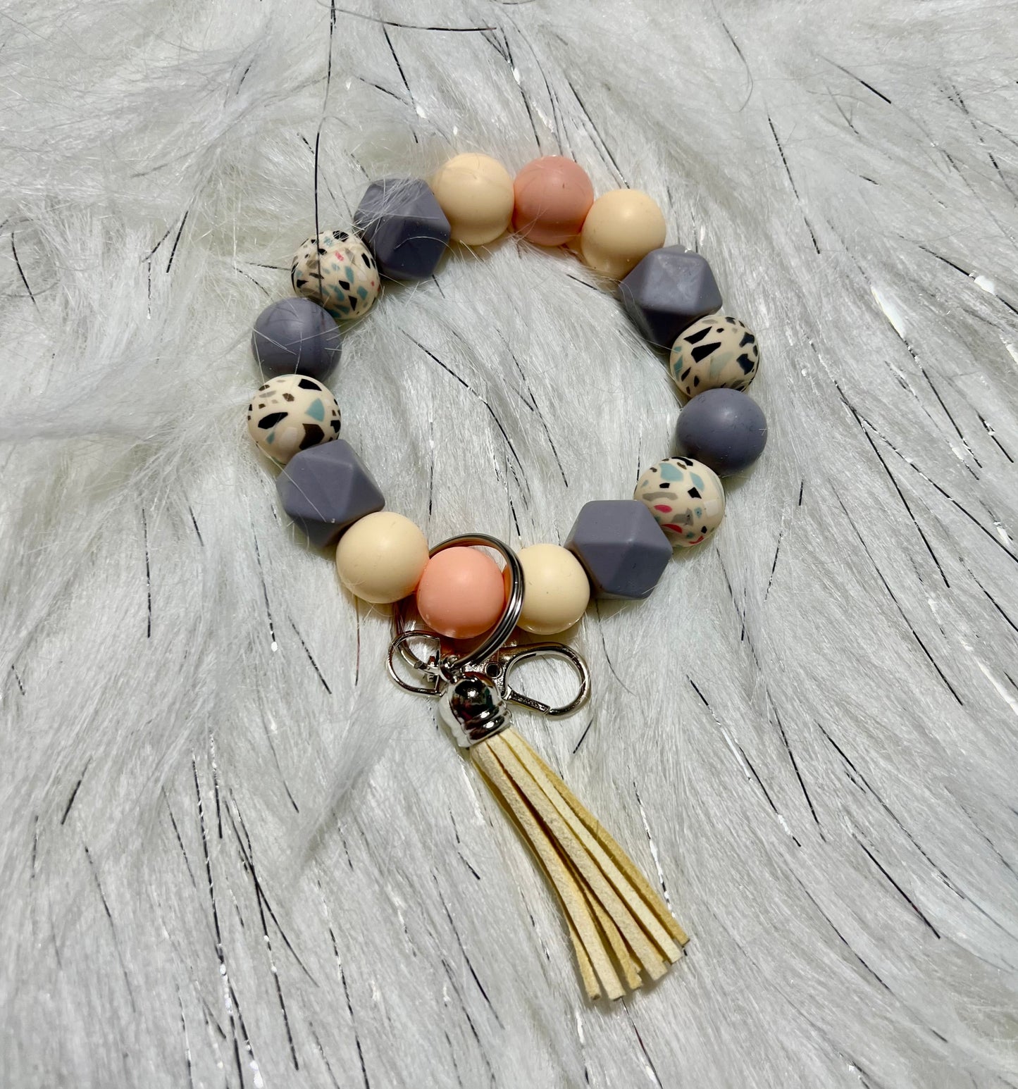 neutral, gray and peach wristlet